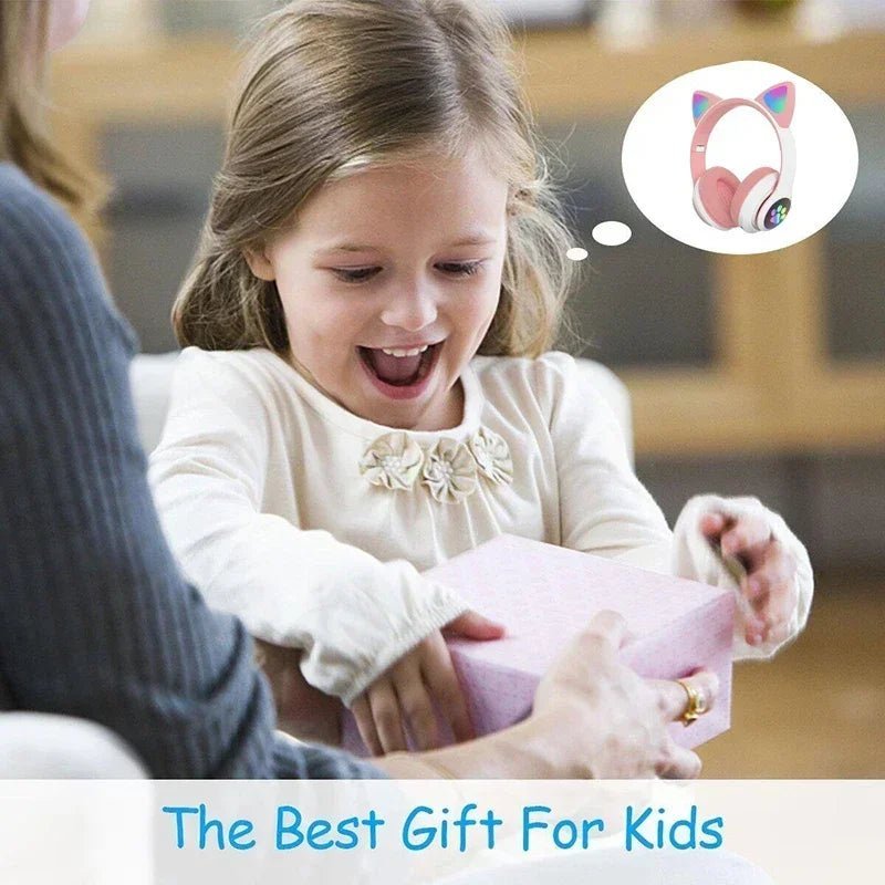Cat ear wireless headphones Kenya STN-28 gifted to a child – girl excited opening pink gift box with headphones inside