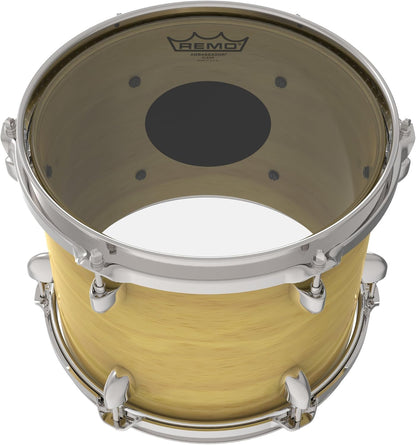 Remo CS-0318-20 Kenya Controlled Sound head mounted on natural-finish tom drum, top-down angle showing black dot