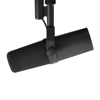 angled view of Shure SM7B Kenya on boom arm, foam windscreen attached, yoke clamp and body visible