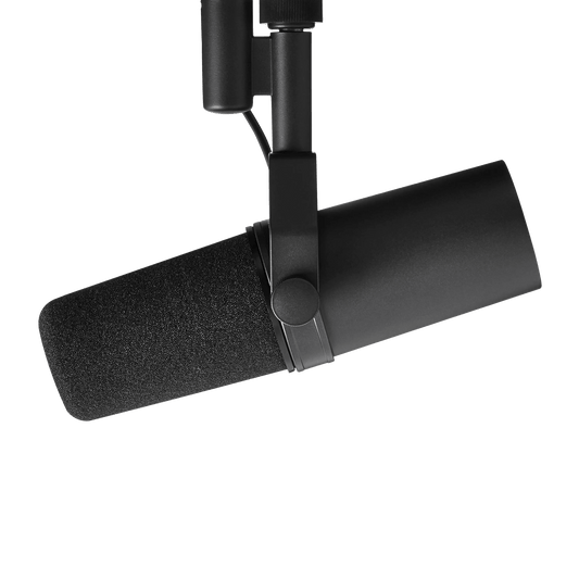 angled view of Shure SM7B Kenya on boom arm, foam windscreen attached, yoke clamp and body visible