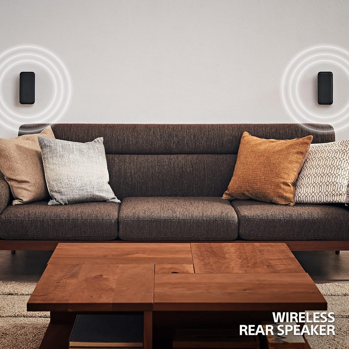Sony HT-S40R home theatre Kenya  wireless rear speakers mounted on living room wall behind sofa, showing surround sound setup