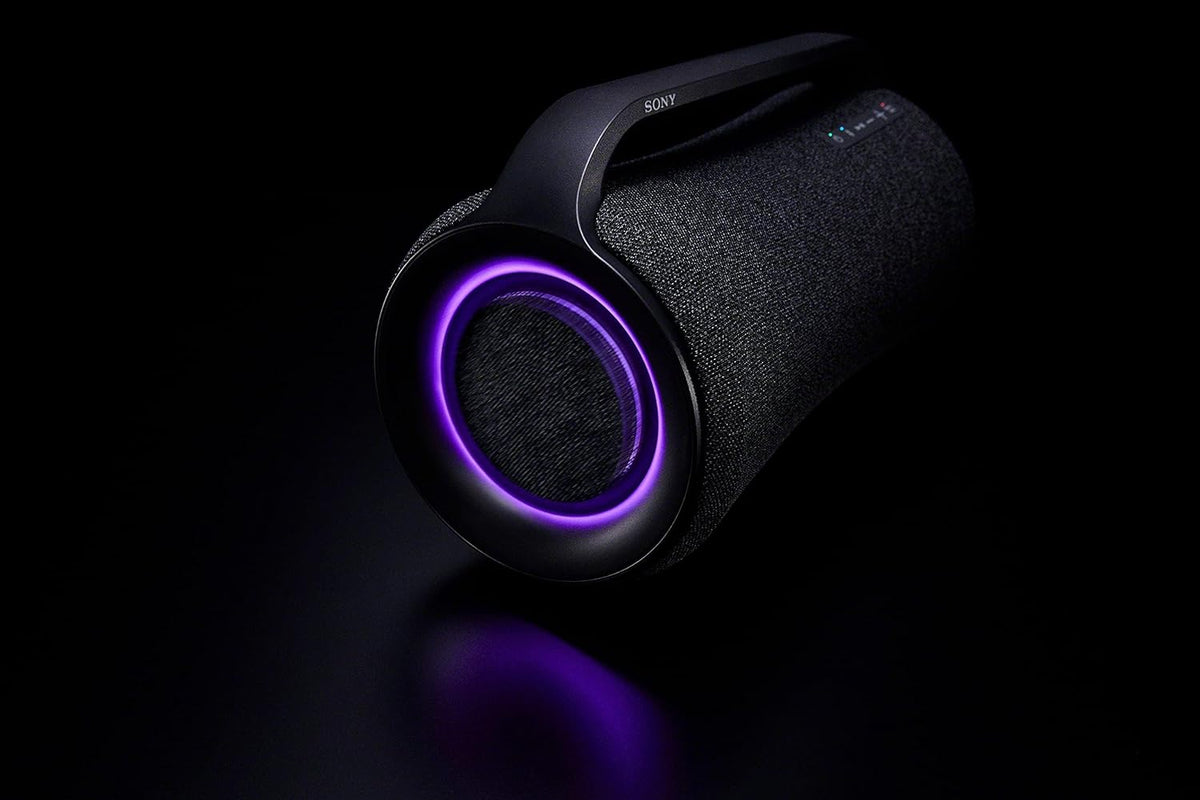 Sony SRS-XG500 Kenya dramatic dark-background shot highlighting purple ambient lighting ring on woofer end