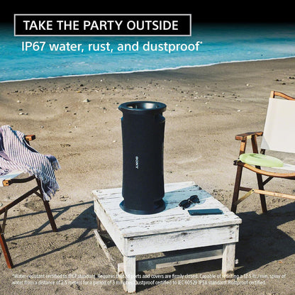 Sony ULT Field 7 Kenya standing upright on beach table outdoors, IP67 waterproof lifestyle shot with ocean backdrop
