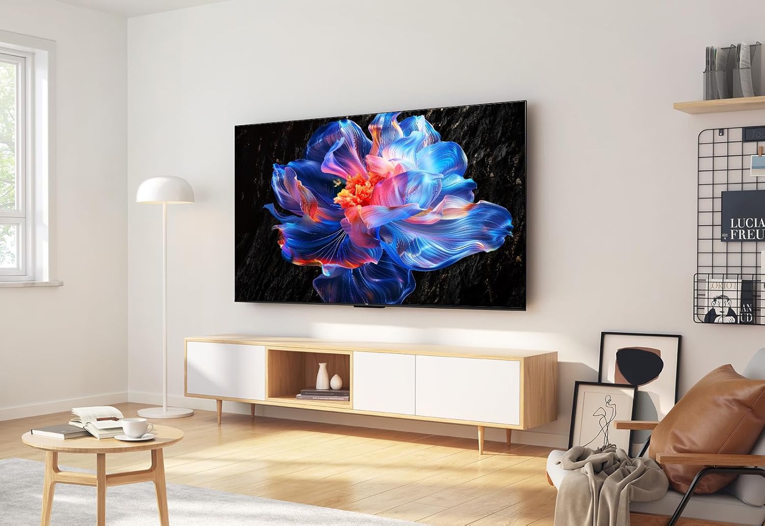 TCL 55V6C Google TV Kenya wall-mounted in a modern living room above a wooden TV unit with ambient lighting