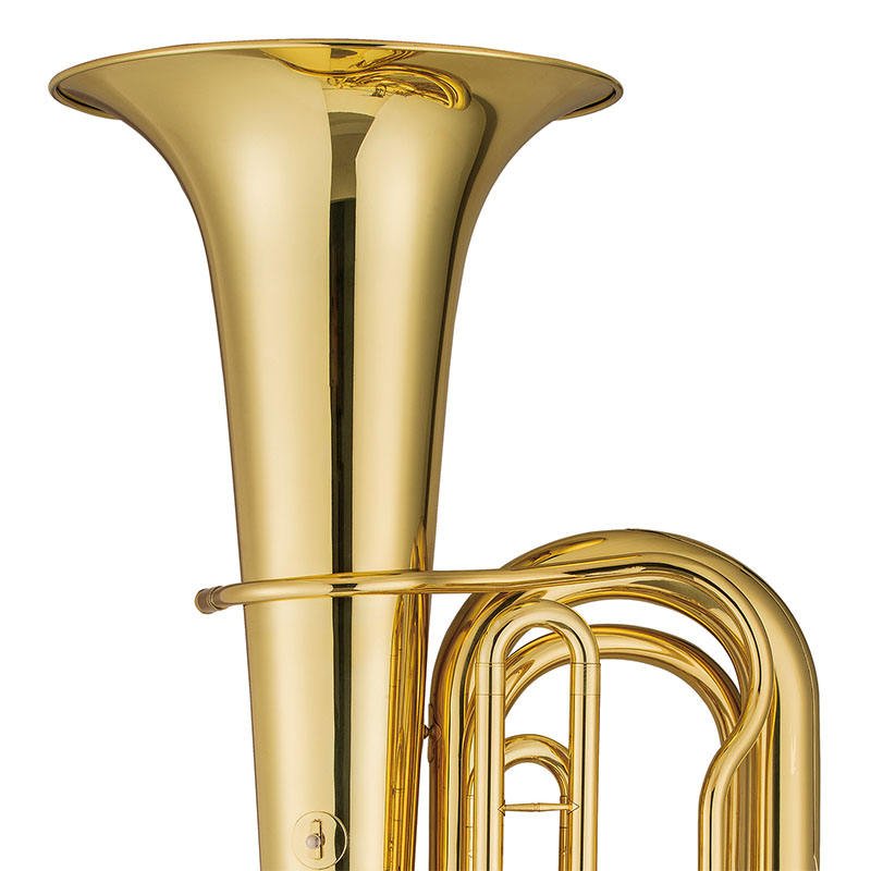 Tuba brass instrument full front view showing bell, rotary valves, and lacquer finish on white background