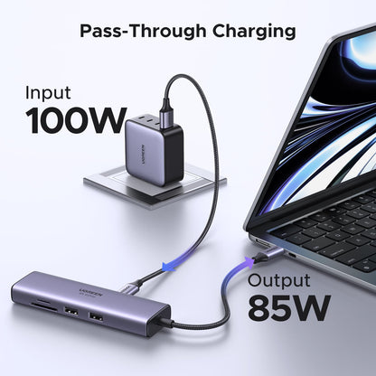 UGREEN Revodok 7-in-1 USB-C Hub Kenya showing 100W pass-through charging with a laptop
