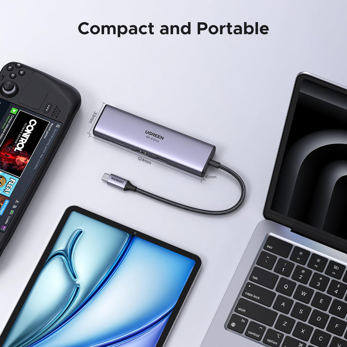 UGREEN Revodok 7-in-1 USB-C Hub Kenya beside laptop, tablet and handheld gaming device